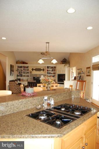 1133 Ragged Edge Road Chambersburg, PA 17202 - Photo 20 of 30 a kitchen with a stove and a refrigerator