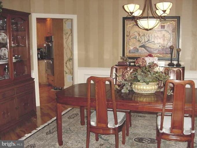 1133 Ragged Edge Road Chambersburg, PA 17202 - Photo 2 of 30 a view of a dining room with furniture window and wooden floor