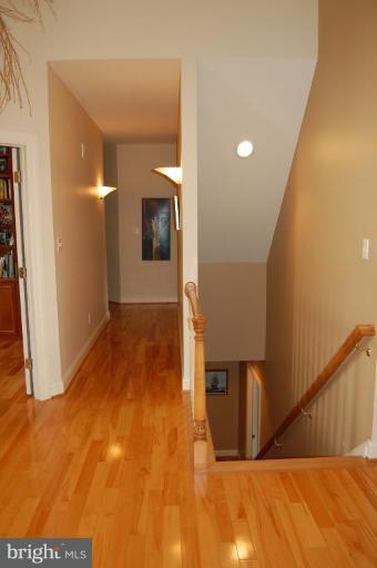 1133 Ragged Edge Road Chambersburg, PA 17202 - Photo 24 of 30 a view of a hallway with wooden floor and staircase