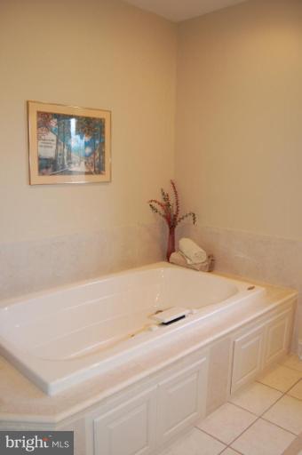 1133 Ragged Edge Road Chambersburg, PA 17202 - Photo 27 of 30 a bathroom with a bathtub and a window