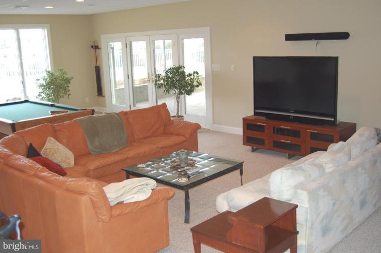 1133 Ragged Edge Road Chambersburg, PA 17202 - Photo 29 of 30 a living room with furniture and a flat screen tv