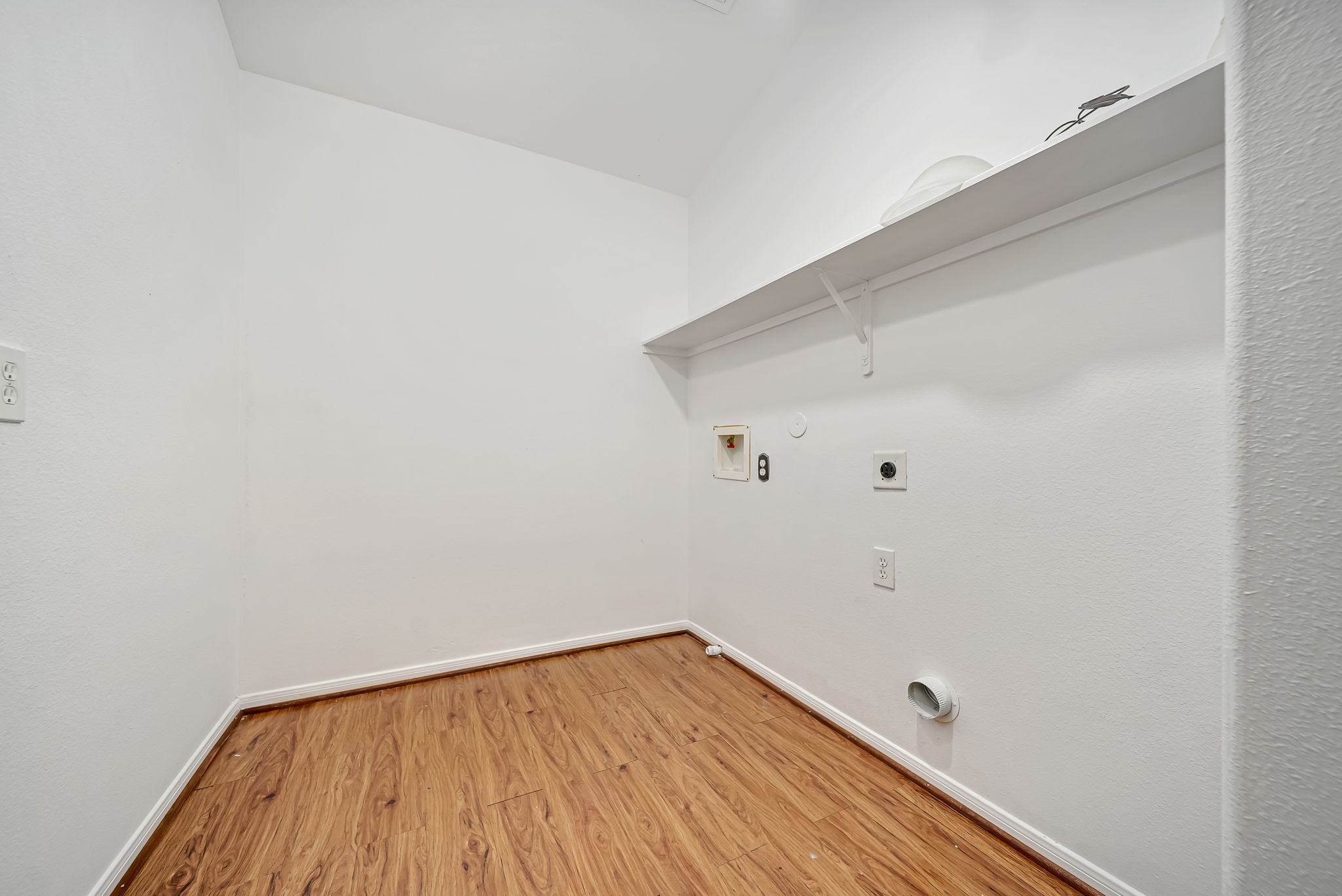 23526 Whispering Maple Drive Spring, TX 77373 - Photo 25 of 26 a view of a room with wooden floor and white walls