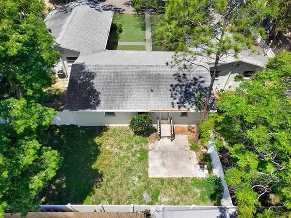 an aerial view of a house with a garden