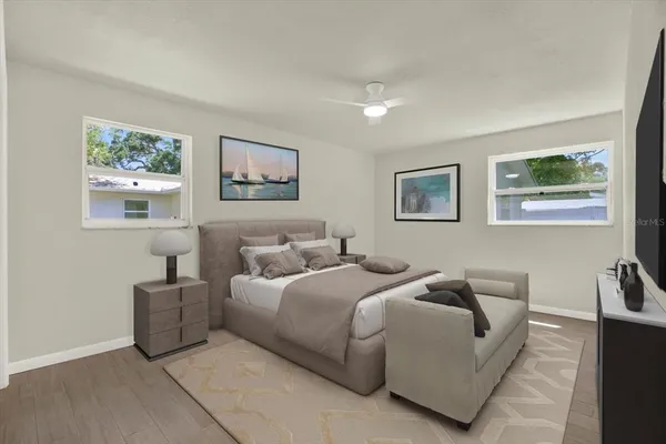 a bedroom with bed and night stand