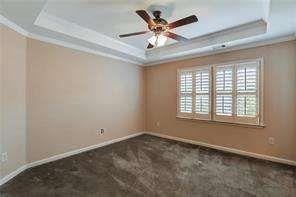 802 Pathview Court Dacula, GA 30019 - Photo 38 of 56 an empty room with chandelier fan and windows
