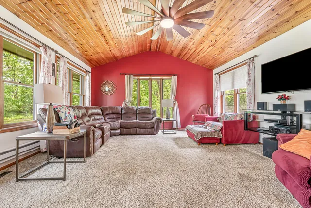 a large kitchen with stainless steel appliances granite countertop a stove sink and cabinets