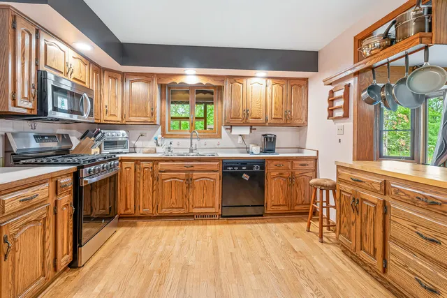 a living room with patio furniture and a floor to ceiling window