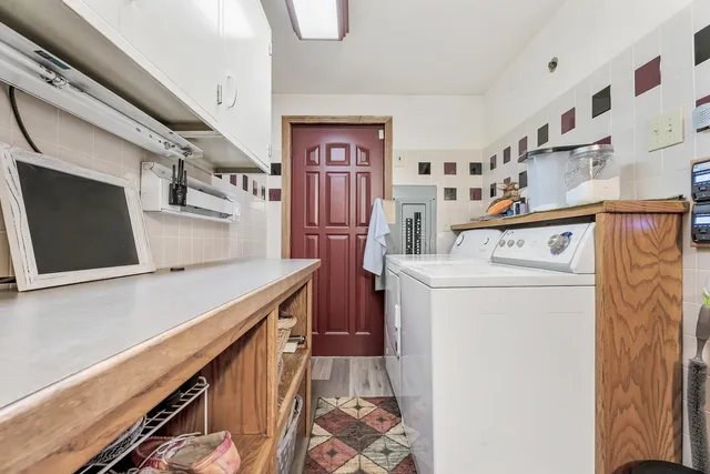 a living room with a fireplace and a flat screen tv