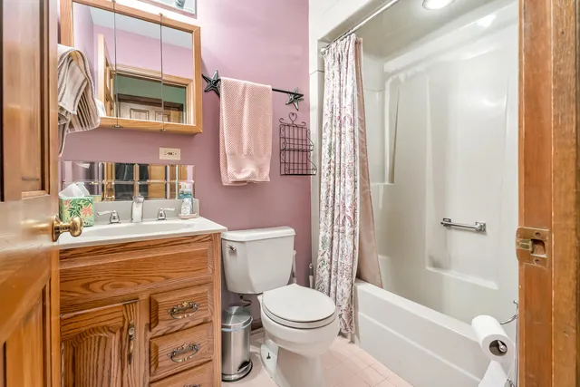 a room with pool table and windows