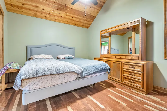 a view of a kitchen with furniture and wooden floor