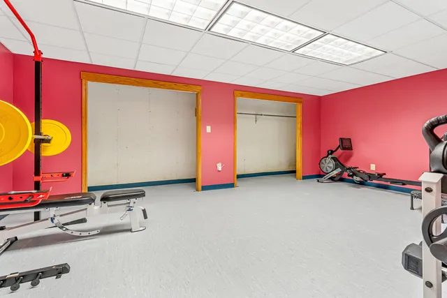 a view of a house with backyard garden and sitting area