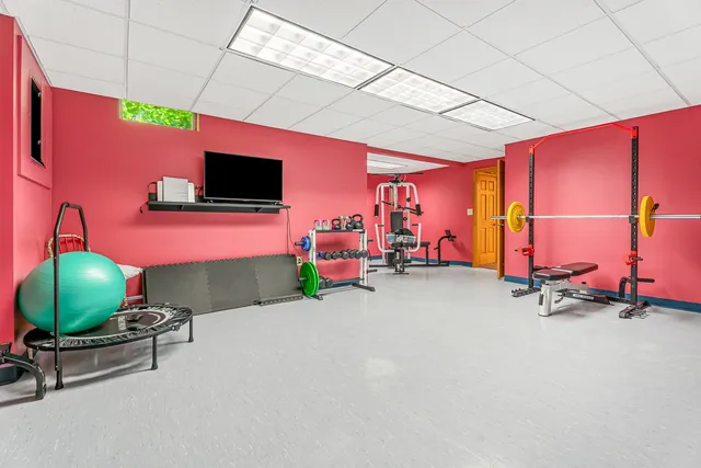 a view of a house with a yard table and chairs