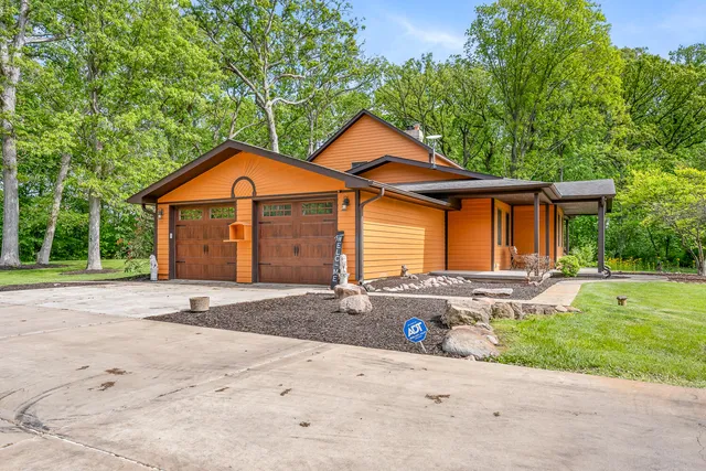 a front view of house with yard and green space