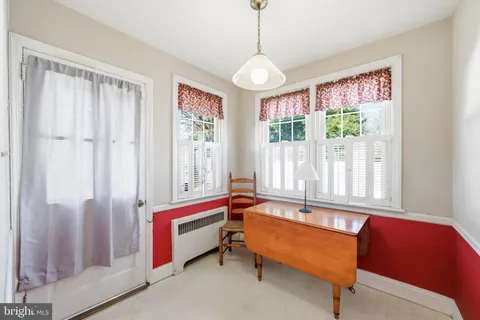 a living room with furniture and windows