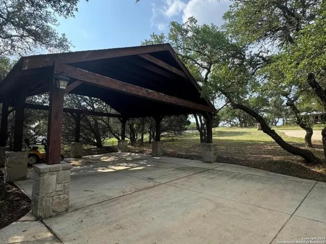 a view of swimming pool with a yard and sitting area