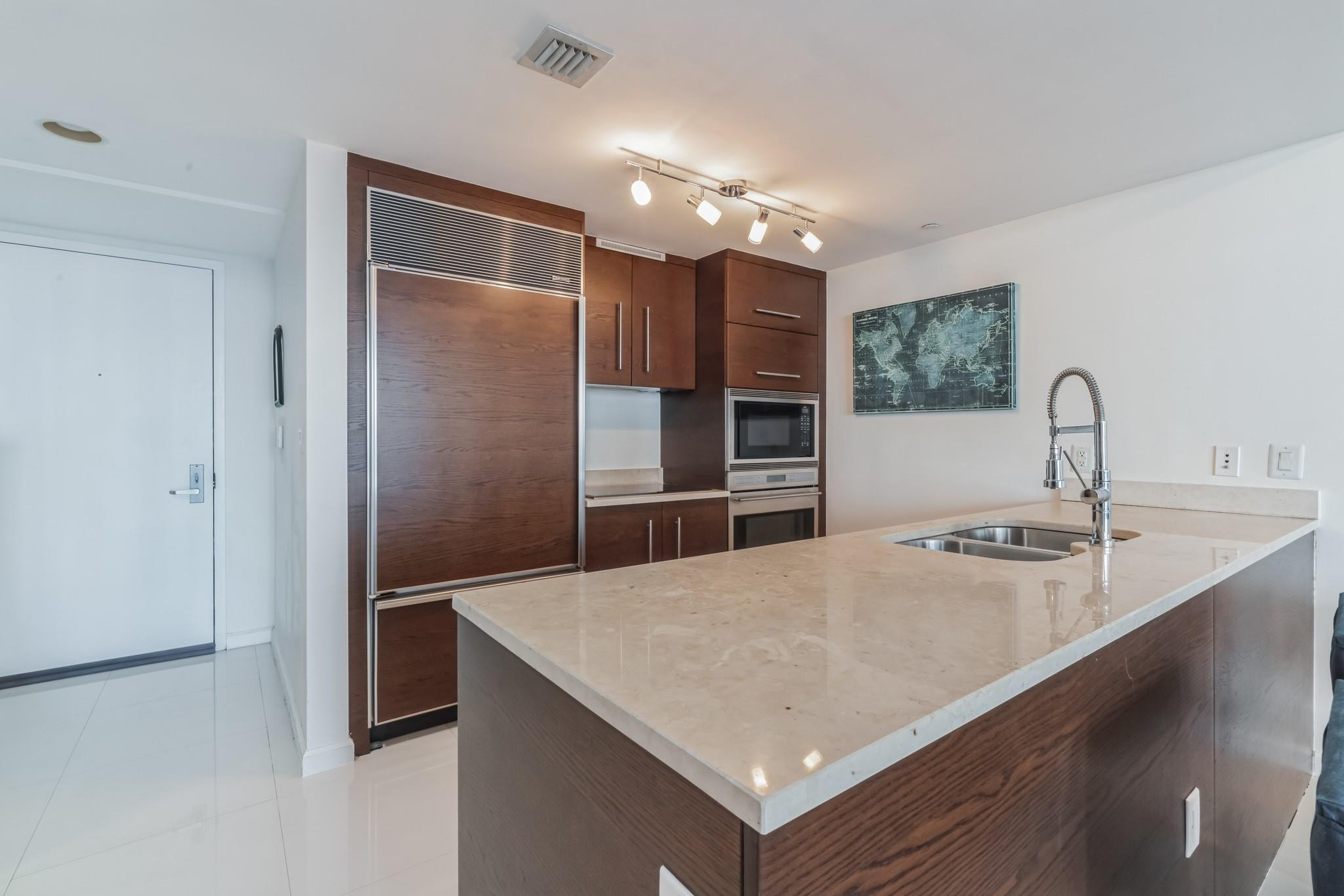 475 Brickell Avenue, Unit 512 Miami, FL 33131 - Photo 11 of 36 a kitchen with refrigerator and a sink