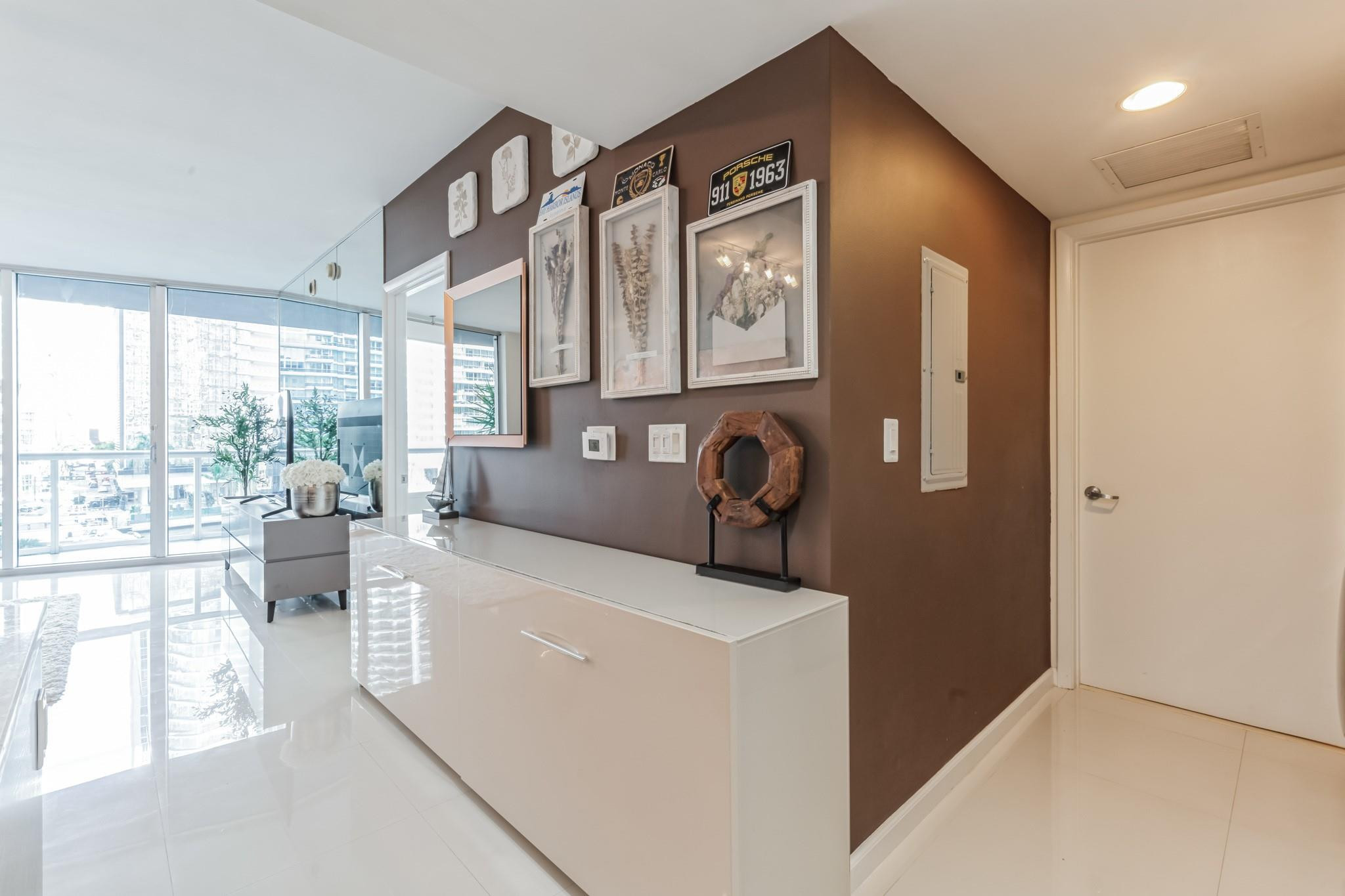 475 Brickell Avenue, Unit 512 Miami, FL 33131 - Photo 13 of 36 a living room with furniture and a floor to ceiling window