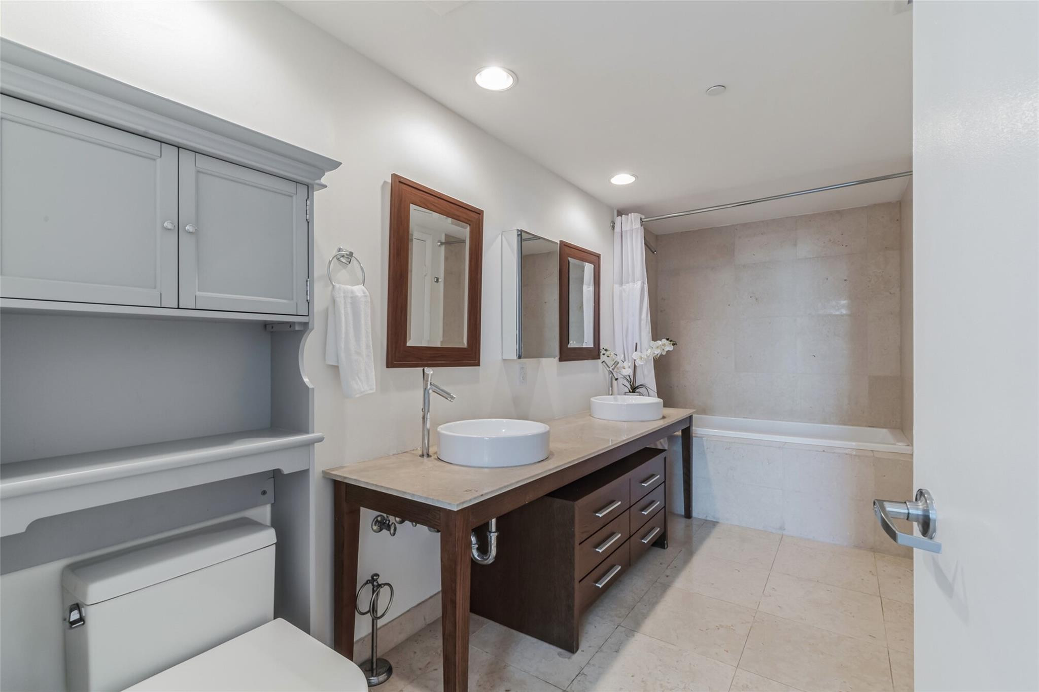 475 Brickell Avenue, Unit 512 Miami, FL 33131 - Photo 14 of 36 a bathroom with a sink and a mirror