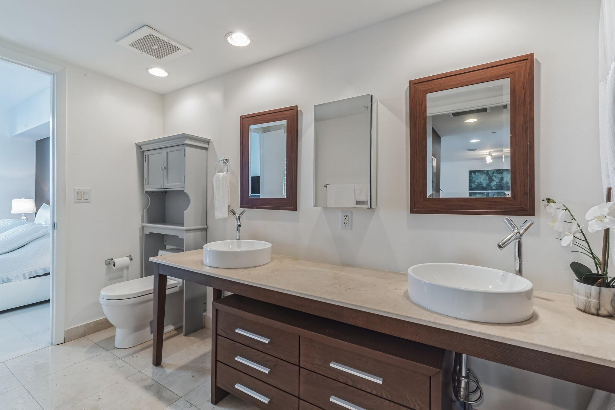 475 Brickell Avenue, Unit 512 Miami, FL 33131 - Photo 16 of 36 a bathroom with a sink and a mirror