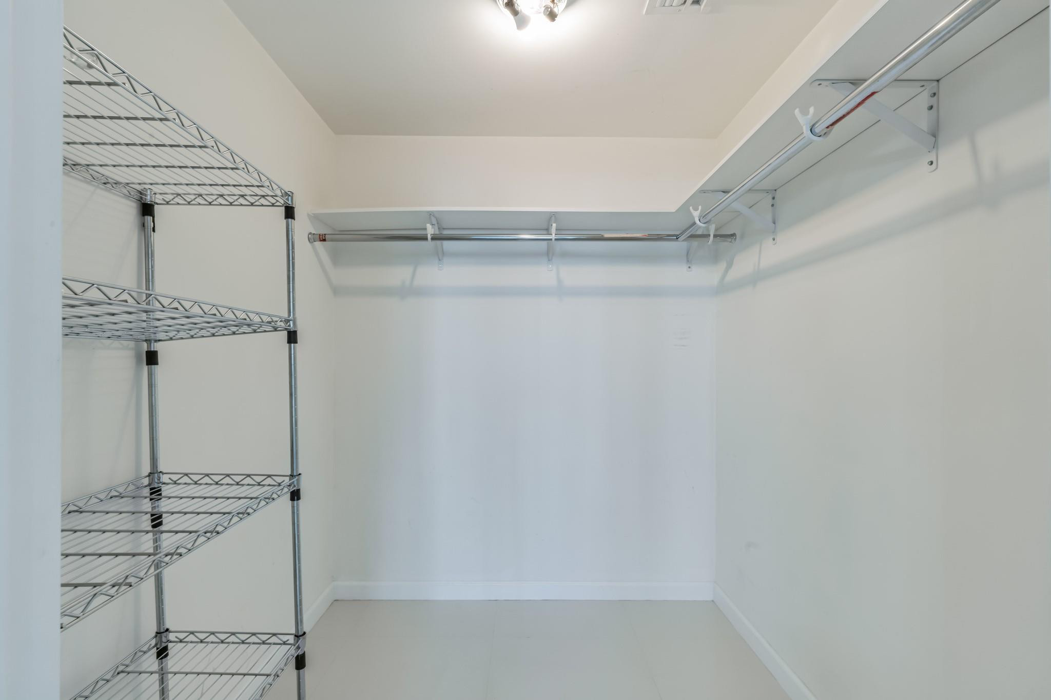 475 Brickell Avenue, Unit 512 Miami, FL 33131 - Photo 28 of 36 a view of a room with racks on the wall