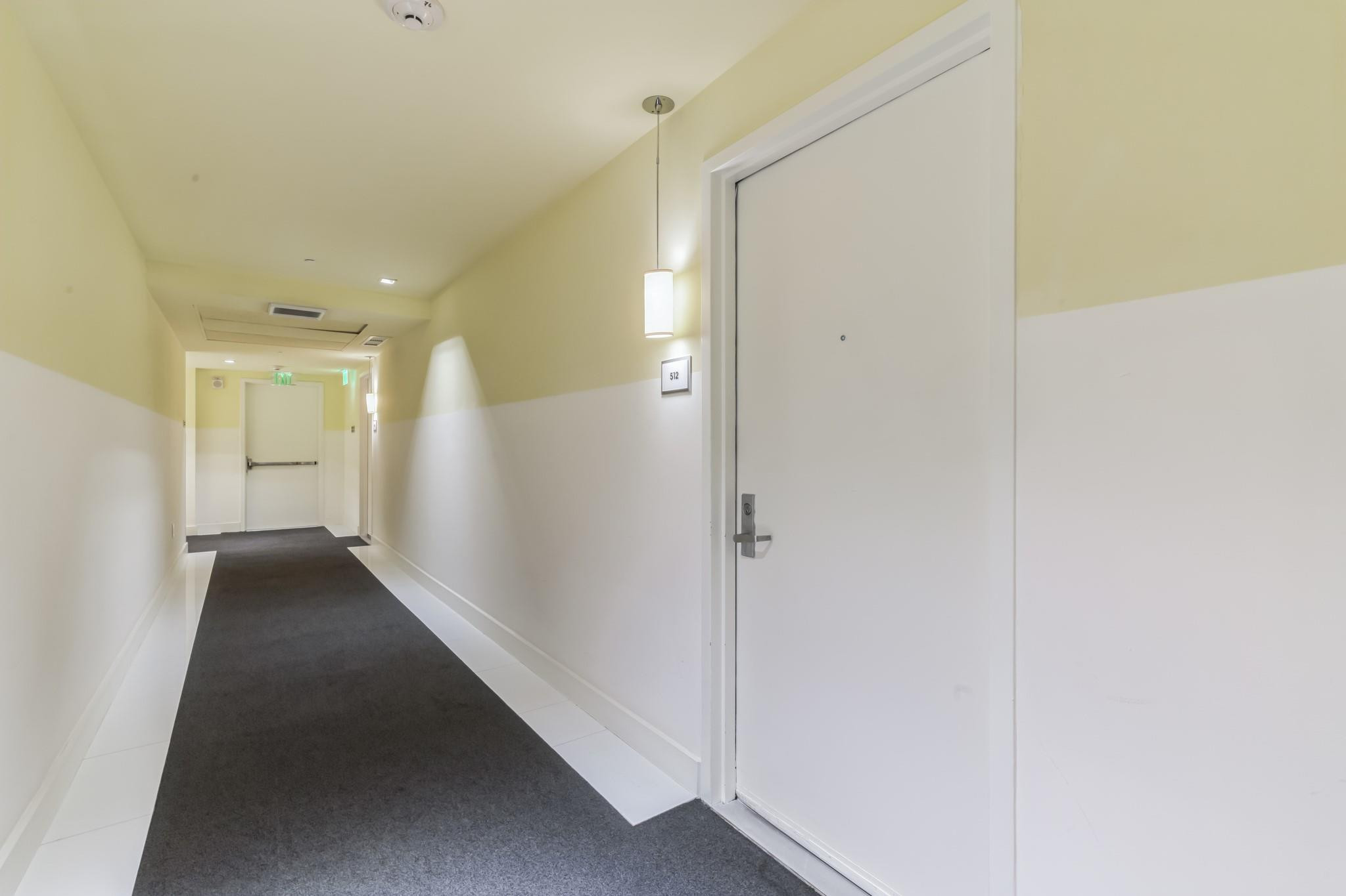 475 Brickell Avenue, Unit 512 Miami, FL 33131 - Photo 29 of 36 a view of a hallway with wooden floor