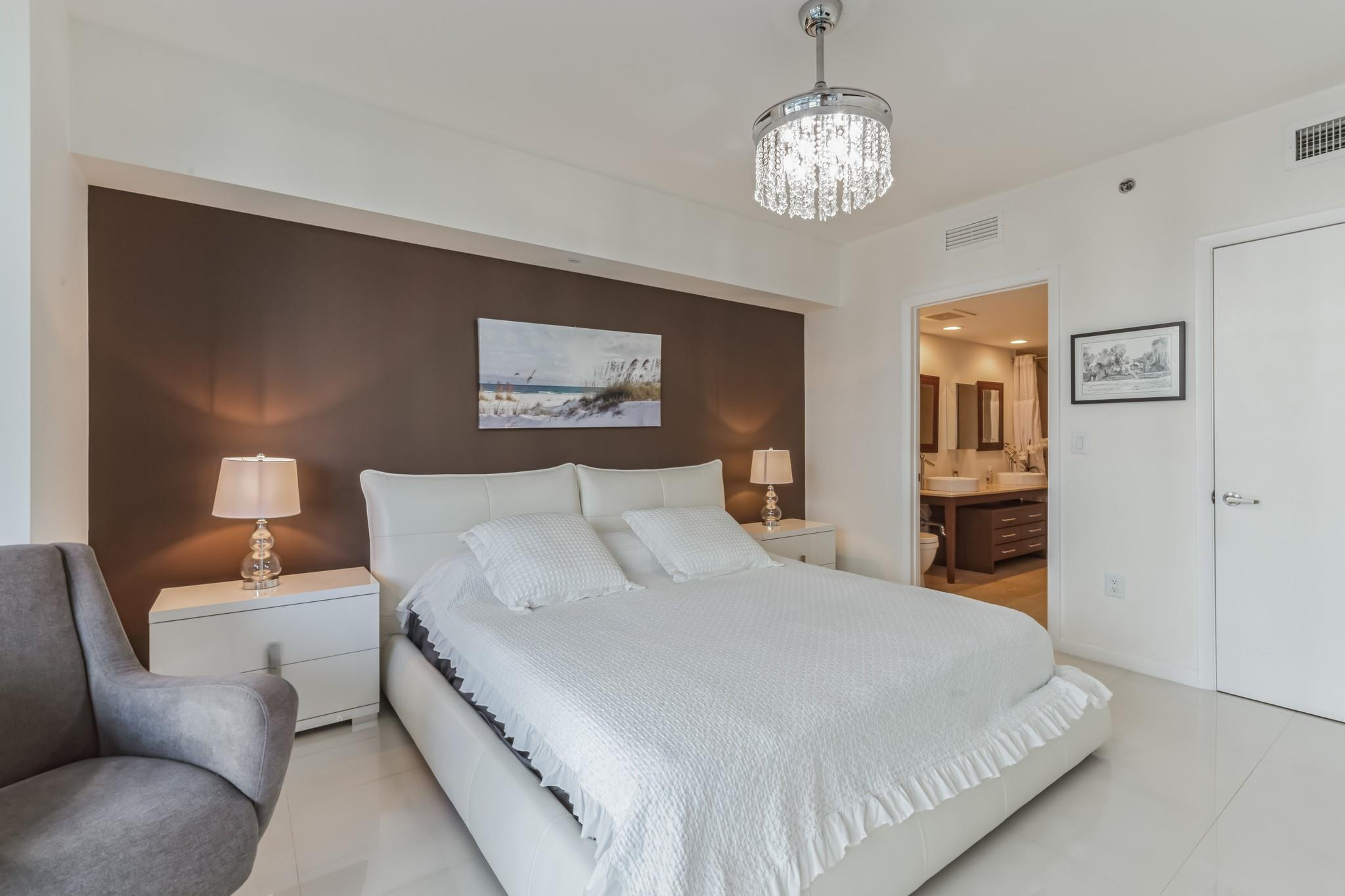 475 Brickell Avenue, Unit 512 Miami, FL 33131 - Photo 5 of 36 a bedroom with bed and furniture