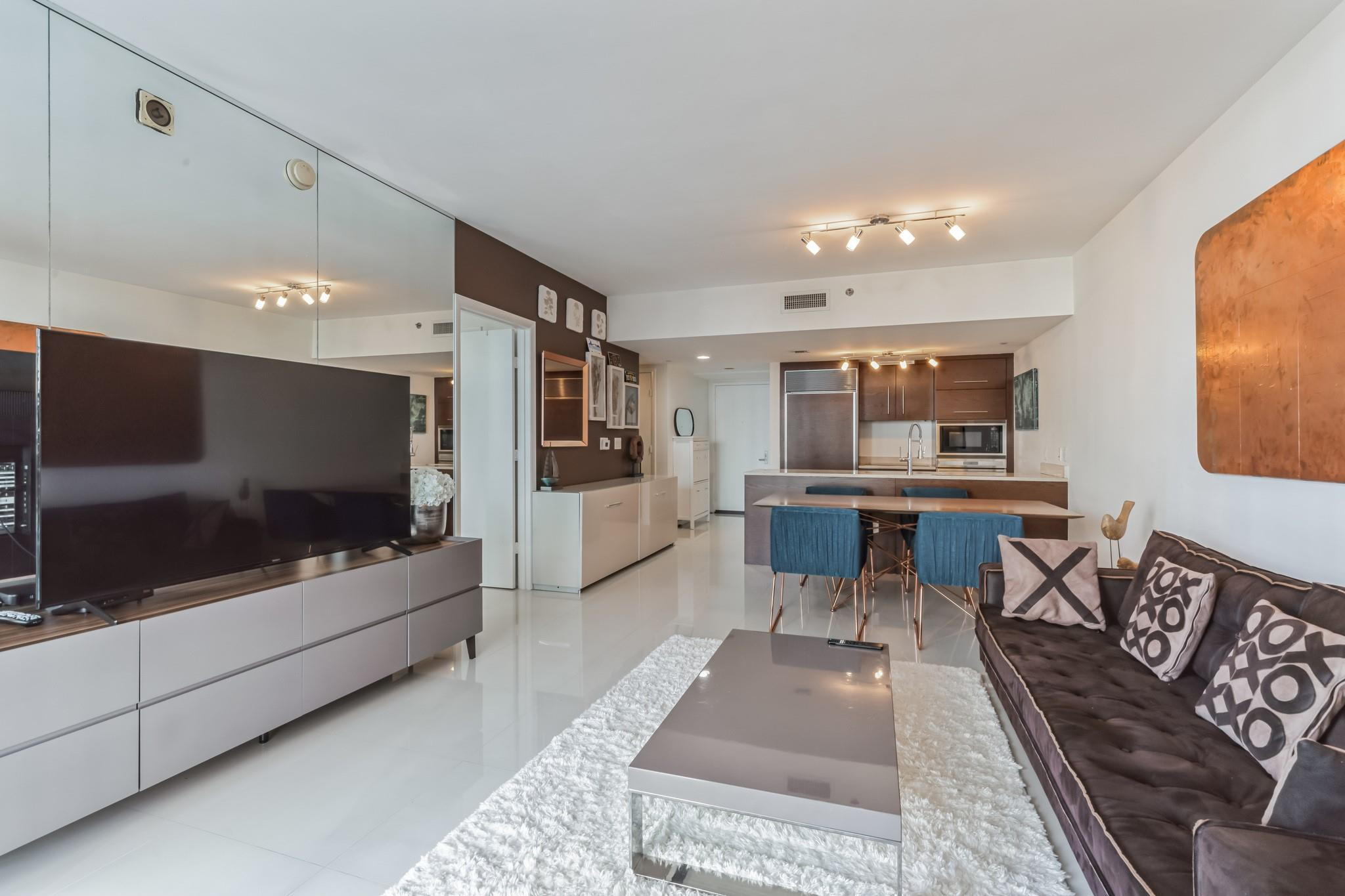 475 Brickell Avenue, Unit 512 Miami, FL 33131 - Photo 9 of 36 a living room with furniture and a flat screen tv