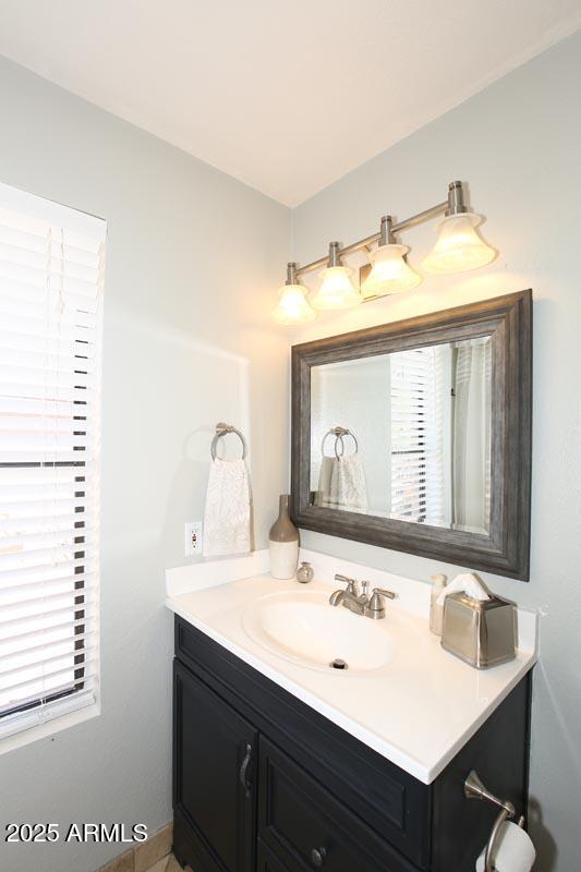 10408 North 11th Place, Unit 3 Phoenix, AZ 85020 - Photo 18 of 31 a bathroom with a sink and a mirror