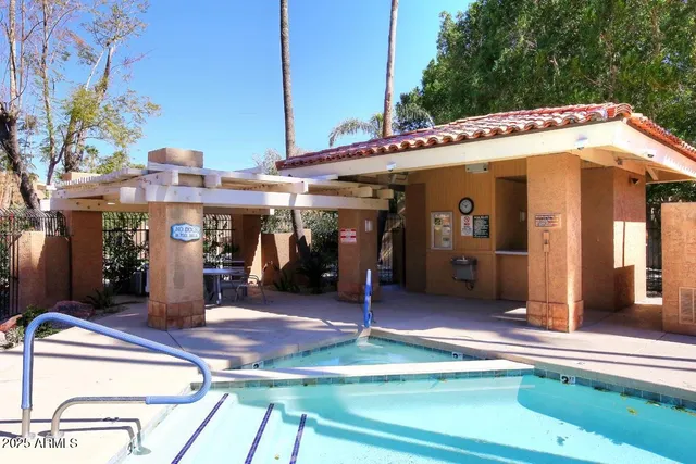 a view of a chairs and table on the balcony
