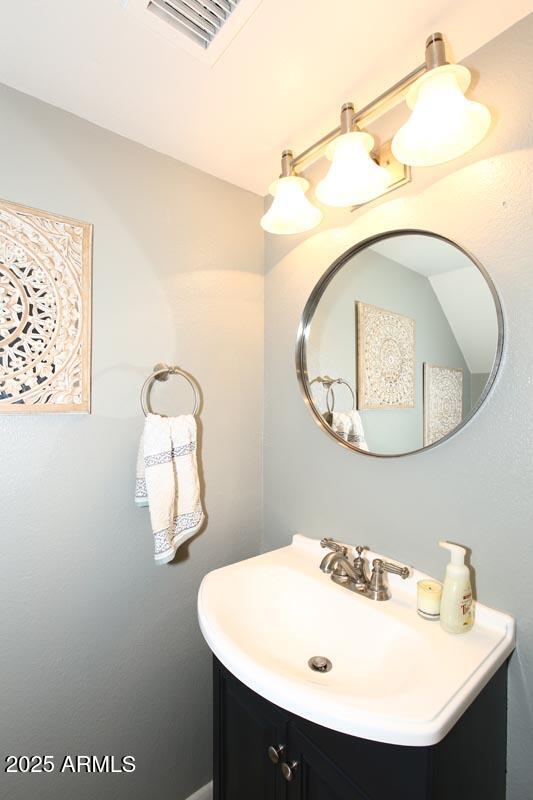 10408 North 11th Place, Unit 3 Phoenix, AZ 85020 - Photo 6 of 31 a bathroom with a sink and mirror