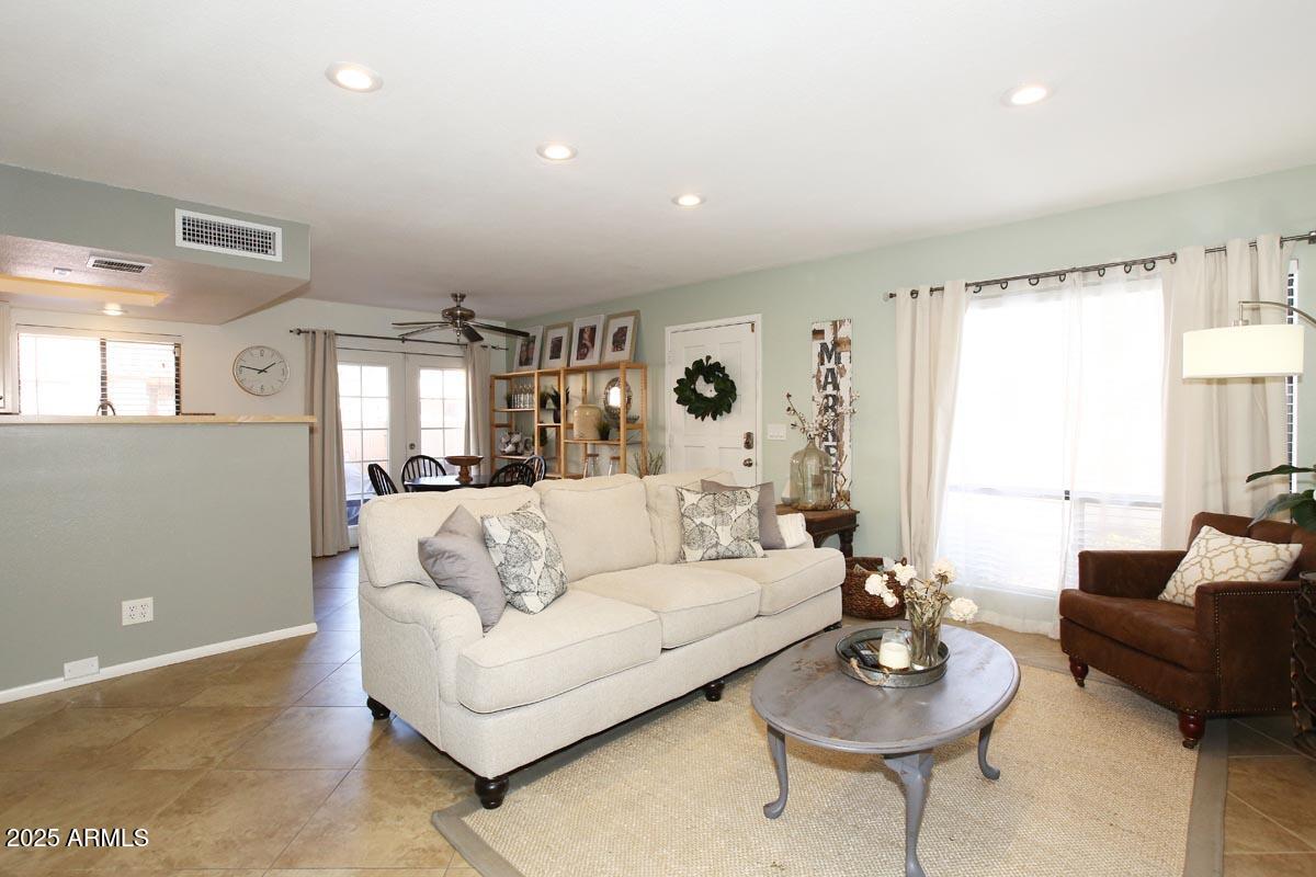 10408 North 11th Place, Unit 3 Phoenix, AZ 85020 - Photo 8 of 31 a living room with furniture and a large window