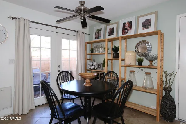 a view of a dining room with furniture and window