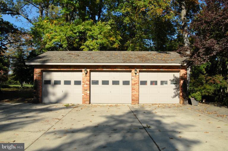1821 Hidden Point Road Annapolis, MD 21409 - Photo 13 of 30 a front view of a house with a yard and garage