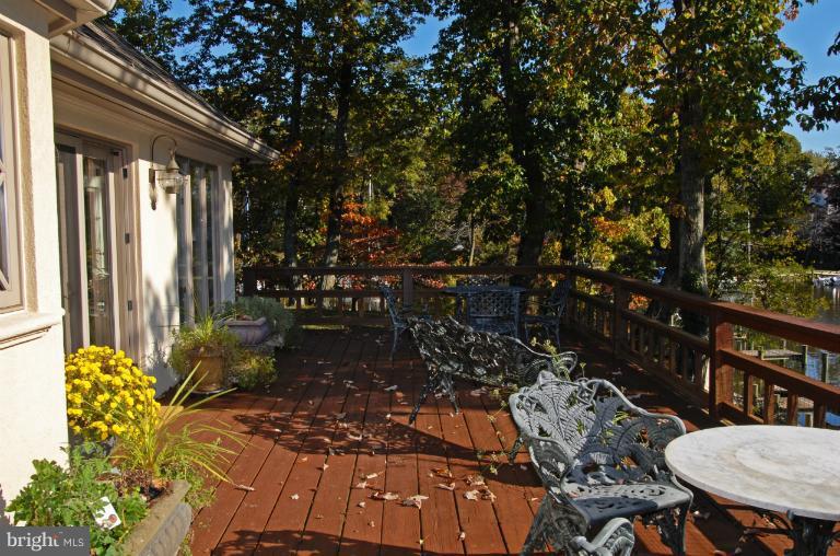 1821 Hidden Point Road Annapolis, MD 21409 - Photo 18 of 30 a view of a chairs and table in backyard