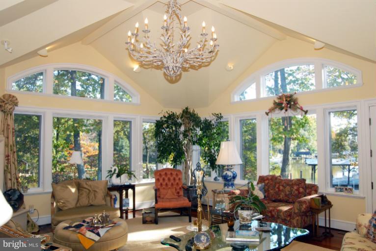 1821 Hidden Point Road Annapolis, MD 21409 - Photo 23 of 30 a living room filled with furniture and a large window
