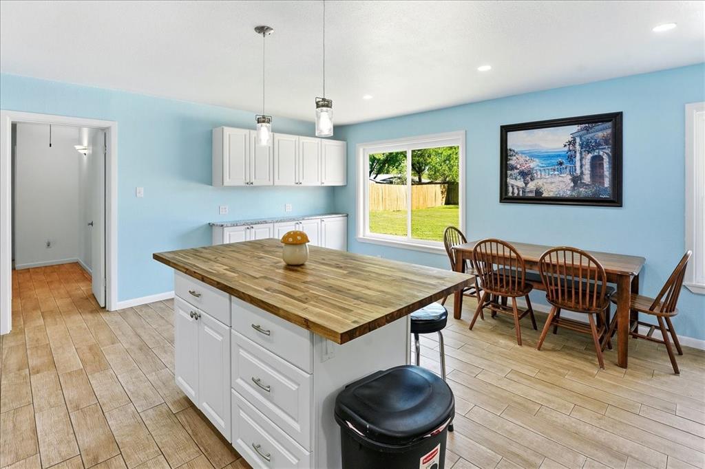 12657 Alma Street Tyler, TX 75704 - Photo 11 of 36 a kitchen with a table and chairs