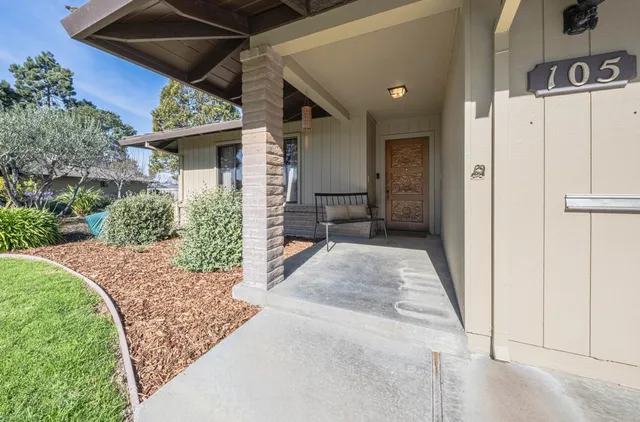 a view of a porch with wooden floor and entryway