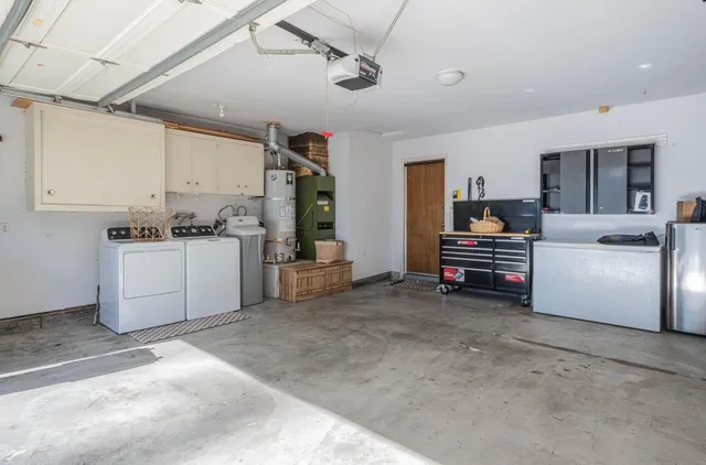a view of a kitchen with appliances and cabinets