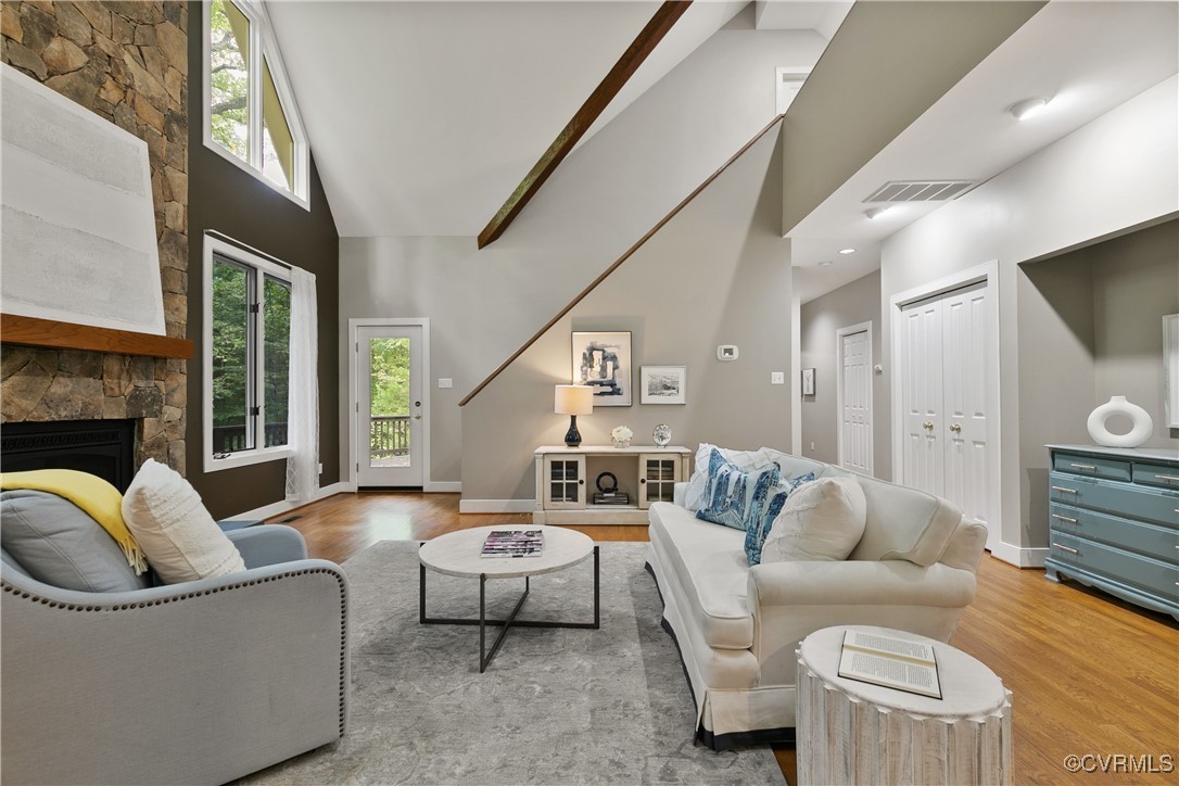 12293 Stancroft Road Rockville, VA 23146 - Photo 17 of 49 Living room featuring a fireplace, high vaulted ce