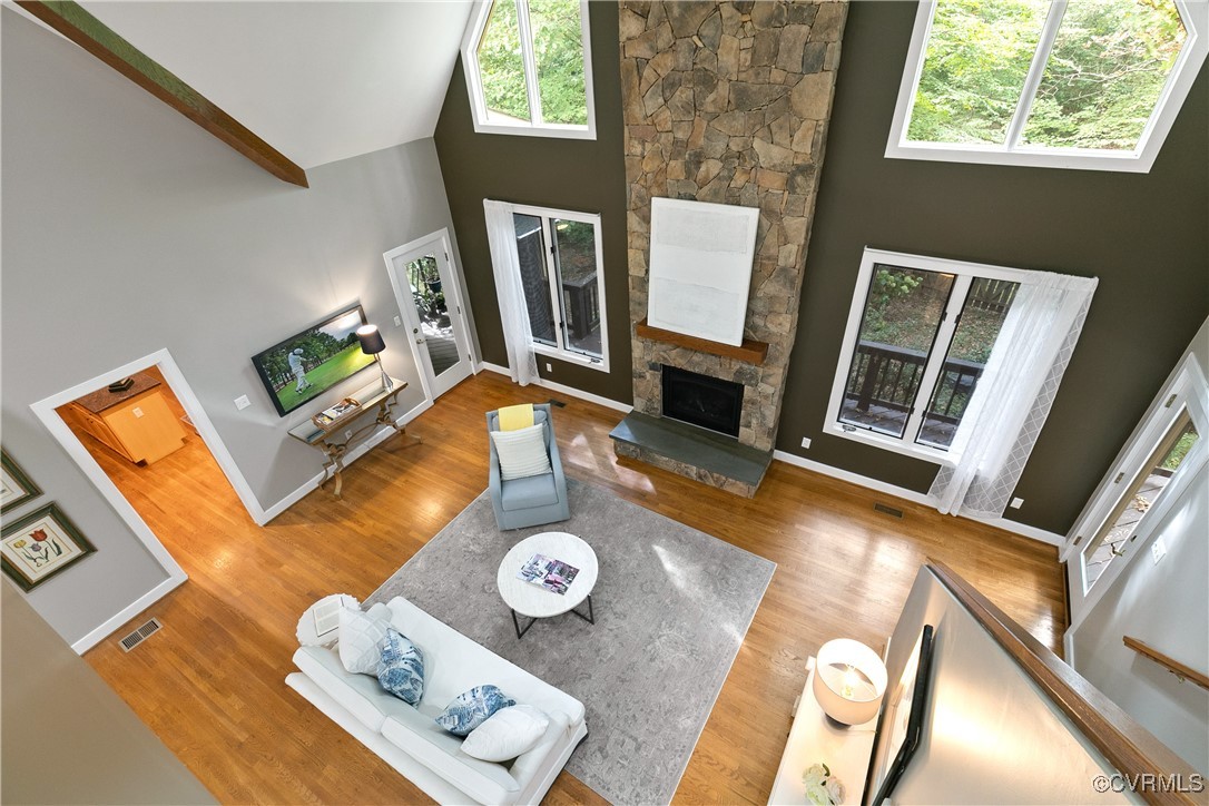 12293 Stancroft Road Rockville, VA 23146 - Photo 18 of 49 Living room featuring beam ceiling, wood-type floo