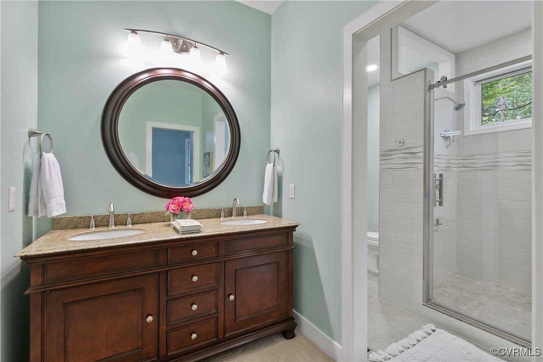 12293 Stancroft Road Rockville, VA 23146 - Photo 23 of 49 Bathroom with vanity, toilet, and walk in shower
