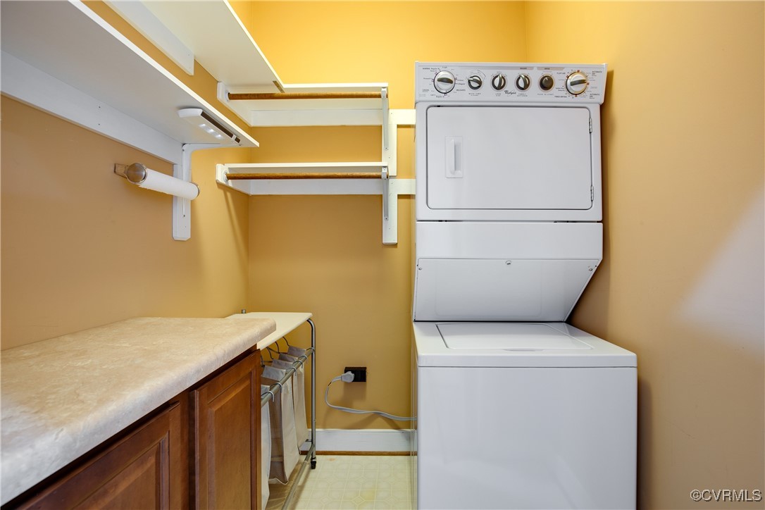 12293 Stancroft Road Rockville, VA 23146 - Photo 25 of 49 Clothes washing area with cabinets and stacked was