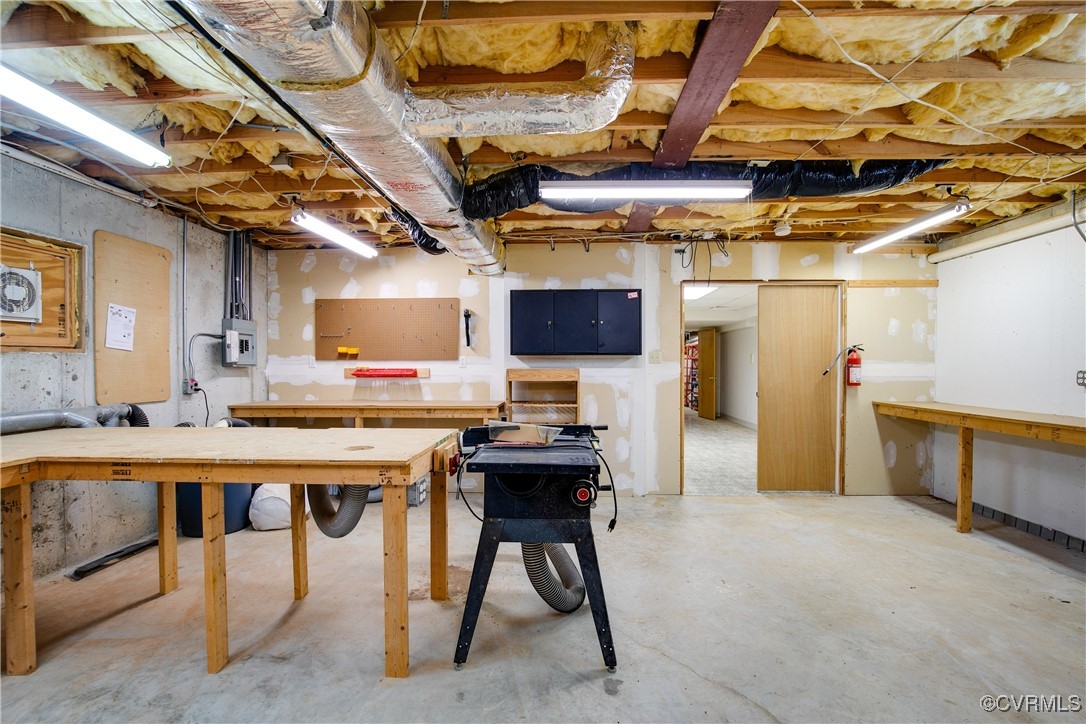 12293 Stancroft Road Rockville, VA 23146 - Photo 39 of 49 Basement workshop with exhaust vacuum