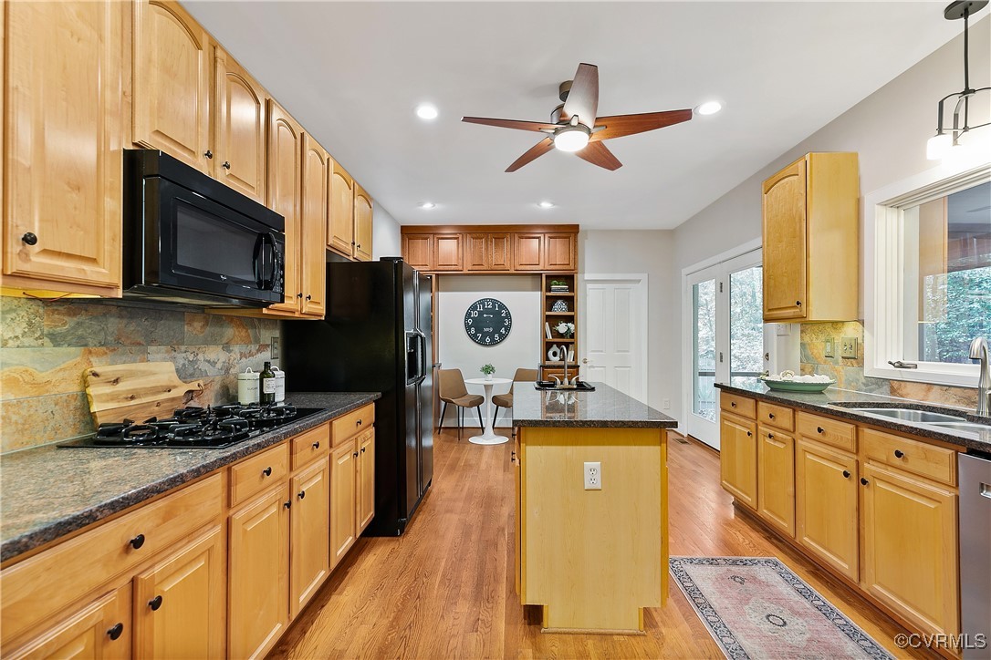 12293 Stancroft Road Rockville, VA 23146 - Photo 6 of 49 Kitchen with ceiling fan, a center island, black a