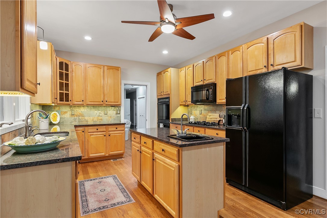12293 Stancroft Road Rockville, VA 23146 - Photo 7 of 49 Kitchen featuring decorative backsplash, sink, bla