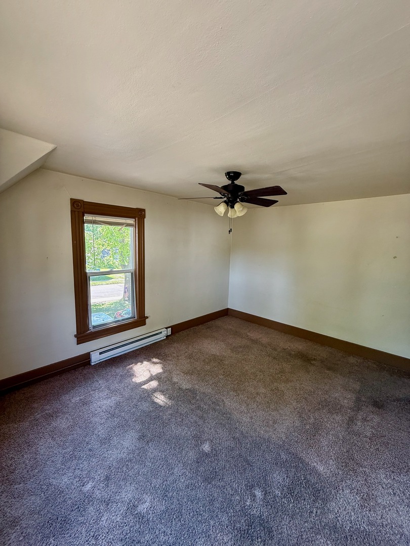913 West 4th Street Dixon, IL 61021 - Photo 2 of 8 an empty room with windows