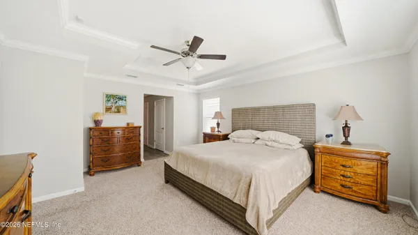 a bedroom with a bed and dresser