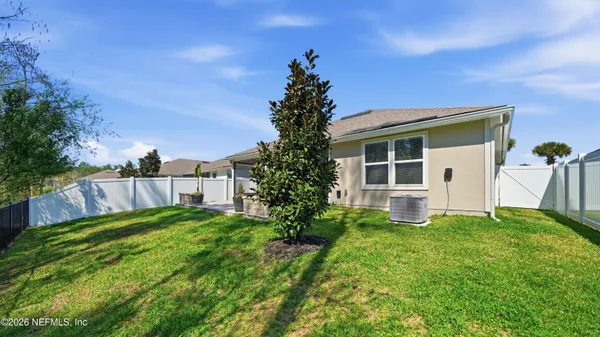 an aerial view of a house with a garden