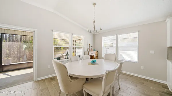 a view of a dining room with furniture window and outside view