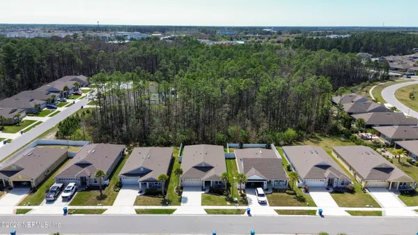 an aerial view of a house with outdoor space